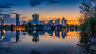 City skyline reflection sunset lake - tall building free wallpaper for desktop