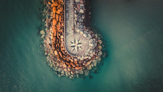 Rock compass beach pier night - a compass free wallpaper