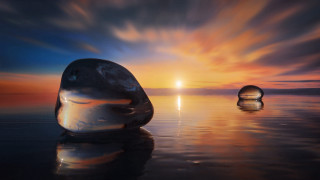 Floating objects sunset ocean reflection - surrealism free wallpaper