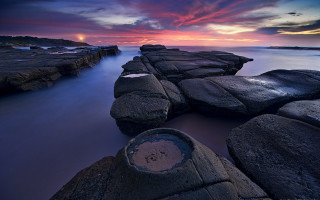 Long exposure sunset rocky beach 2 - a long exposure of a sunset over a rocky beach free wallpaper
