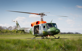 Helicopter man field trees sky - free airplane wallpaper