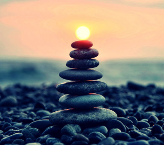 Stacked rocks beach ocean candle - a stack of rocks free wallpaper