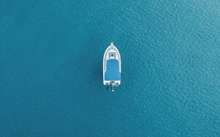 Small boat ocean shoreline minimalism - a small boat free wallpaper