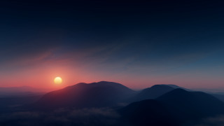 Sunset mountain range clouds horizon 3 - a bright sun in the distance free wallpaper