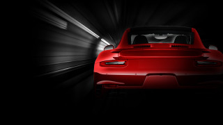 Red sports car tunnel dark - a white light free wallpaper