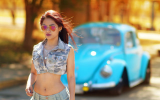 Blue shirt woman walking street - a blue car free wallpaper