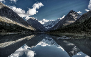Mountain range lake clouds reflections - a lake in the foreground free wallpaper