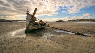 Boat beach sky clouds water - a sandy beach next free wallpaper