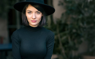 Elina karimova black hat green - a green plant in the background free wallpaper