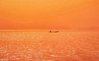 Boat person in foreground sunset - bikash bhattacharjee free wallpaper