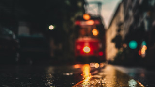 Blurry bus tiltshift night fire - side and a building in the background free wallpaper