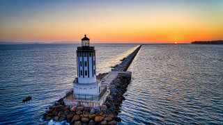 Lighthouse pier ocean sunset romanticism - radiant free wallpaper for desktop