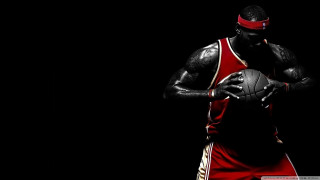 Man holding basketball red uniform - a red uniform free wallpaper