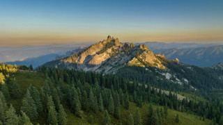 Mountain forest sky clouds distant - a forest below free wallpaper