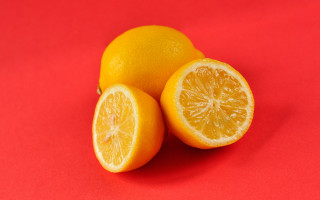 Orange halves red background food - a red background behind them free wallpaper