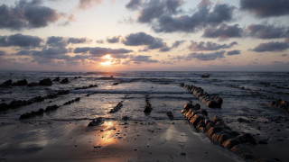 Sunset ocean rocks water clouds 7 - the foreground and a sky free wallpaper