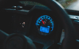 Car dashboard speedometer red needle - a car dashboard free wallpaper