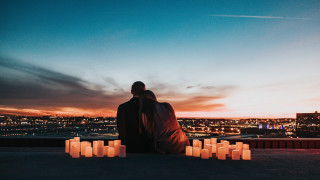 Romantic couple candles sunset cityscape - free valentines wallpaper