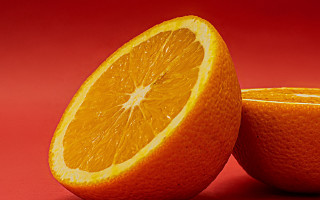 Orange halved both on red - one cut free wallpaper