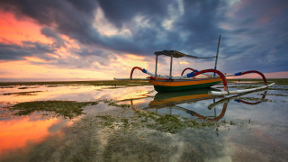 Boat water sunset flag cloudy - water under a cloudy sky free wallpaper