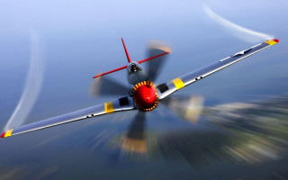 Small airplane over water sky - the wing free wallpaper