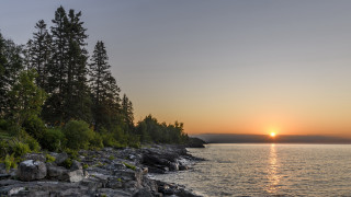 Sunset lake trees rocks water - a sunset over a lake free wallpaper for desktop