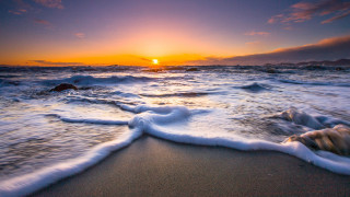 Sunset ocean waves rock beach - a sunset over the ocean free wallpaper for desktop