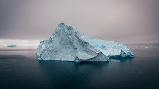 Large iceberg ocean cloudy background - iceberg free wallpaper