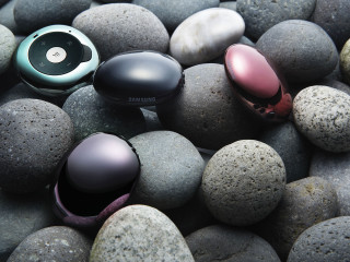 Colored earphones rocks gravel group - product photo free wallpaper