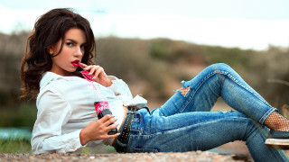 Woman sitting outdoors popart denim - her hand and a cell phone free wallpaper
