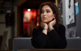 Elina karimova serious portrait blurry - a woman sitting free wallpaper