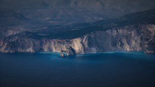 Mountain ocean boat shore sky - the water near free wallpaper for desktop