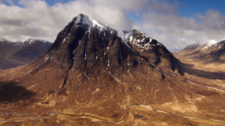 Mountain range winding road cloudy 2 - free mountains wallpaper