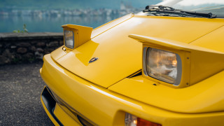 Yellow sports car lake mountain - a yellow sports car free wallpaper