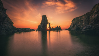 Sunset water rocks clouds boats - a few boat free wallpaper