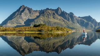 Boat mountain lake forest sky - the water near a mountain range free wallpaper
