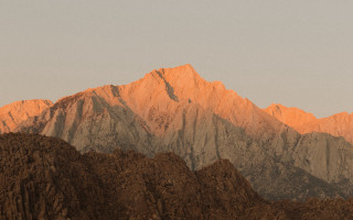 Plane mountain sunset foreground flare - over a mountain range free wallpaper