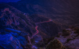 Winding road mountains night red - red light free wallpaper