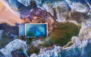 Blue ocean pool beach synchromism - a beach in the background free wallpaper