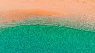 Beach ocean sand boat sky - a sandy shore free wallpaper