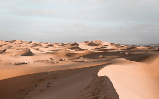 Desert sand dunes clouds footprints - a few footprint free wallpaper