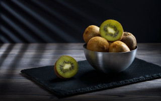 Kiwi bowl black cloth table - underneath free wallpaper