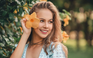 Woman flower smile outdoors bokeh 2 - a smile free wallpaper