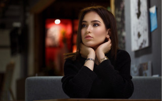 Woman sitting serious brown hair - free vintage wallpaper