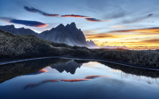 Mountain range lake sunset clouds 3 - the foreground and a sunset in the background free wallpaper