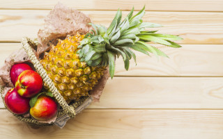 Pineapple apples oranges basket table - a pineapple free wallpaper