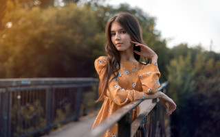 Woman leaning on rail serious - a rail free wallpaper