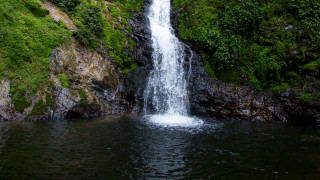 Waterfall surrounded by trees bushes - alexander brook free wallpaper