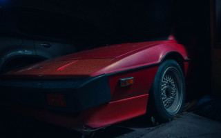 Red sports car dark garage 5 - a dark garage free wallpaper