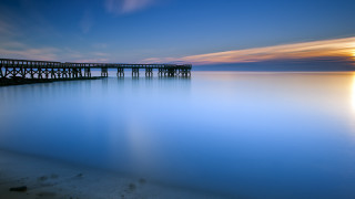 Pier sunset calm water reflection - a blue sky and water free wallpaper